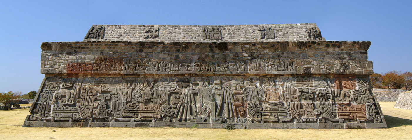 <p>Very deteriorated in 19th century, very reconstructed now. Two stepped pyramid. Slightly unusual shape (second level slightly set back). Central Mexican and Mayan features. Figures on the top level in a clear pose of a seated figure (Mayan), seated lords like in Altar Q. The feathered serpent is a quetzalcoatl.</p>