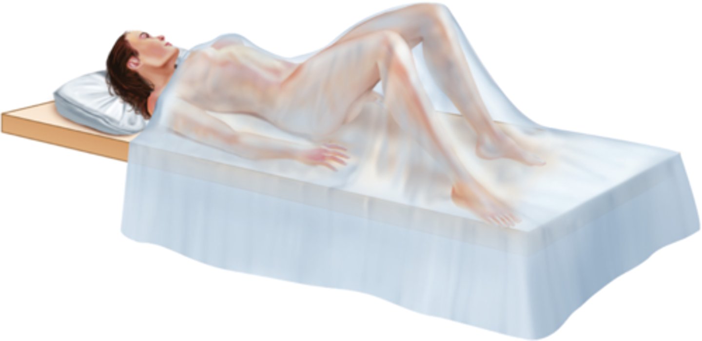 <p>On back with lower extremities flexed and rotated outward</p>