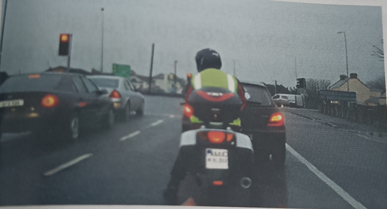 <p>In what position should a motorcyclist have their feet when stopped at traffic lights, stop signs or in traffic?</p>