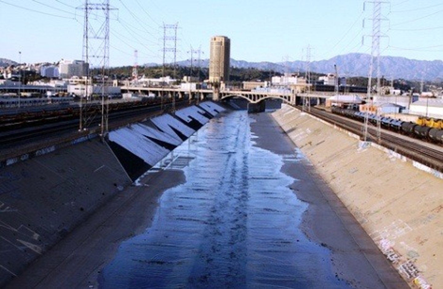 <p>Surfaces like concrete that do not absorb water, increasing runoff.</p>