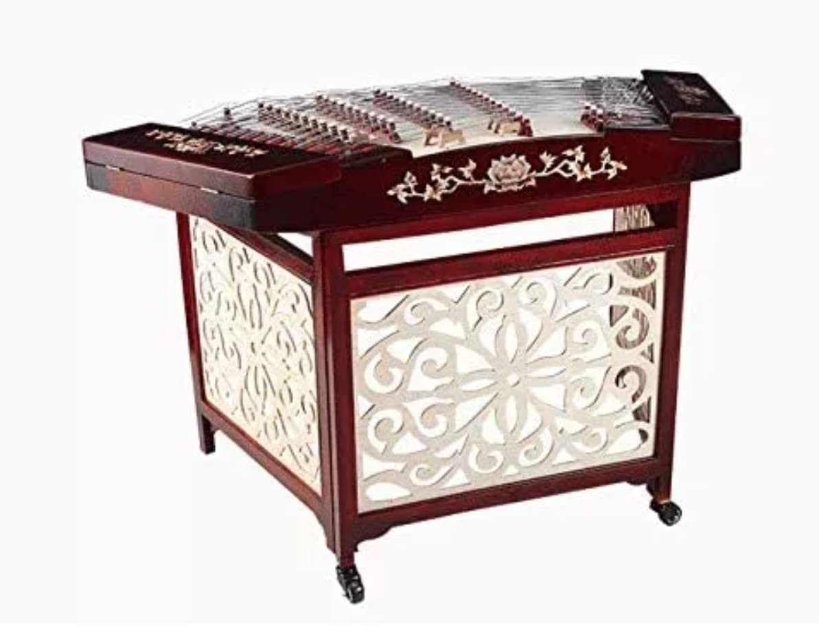 <p>Trapezoidal shaped hammer dulcimer</p><p>Hit with two bamboo beaters</p>