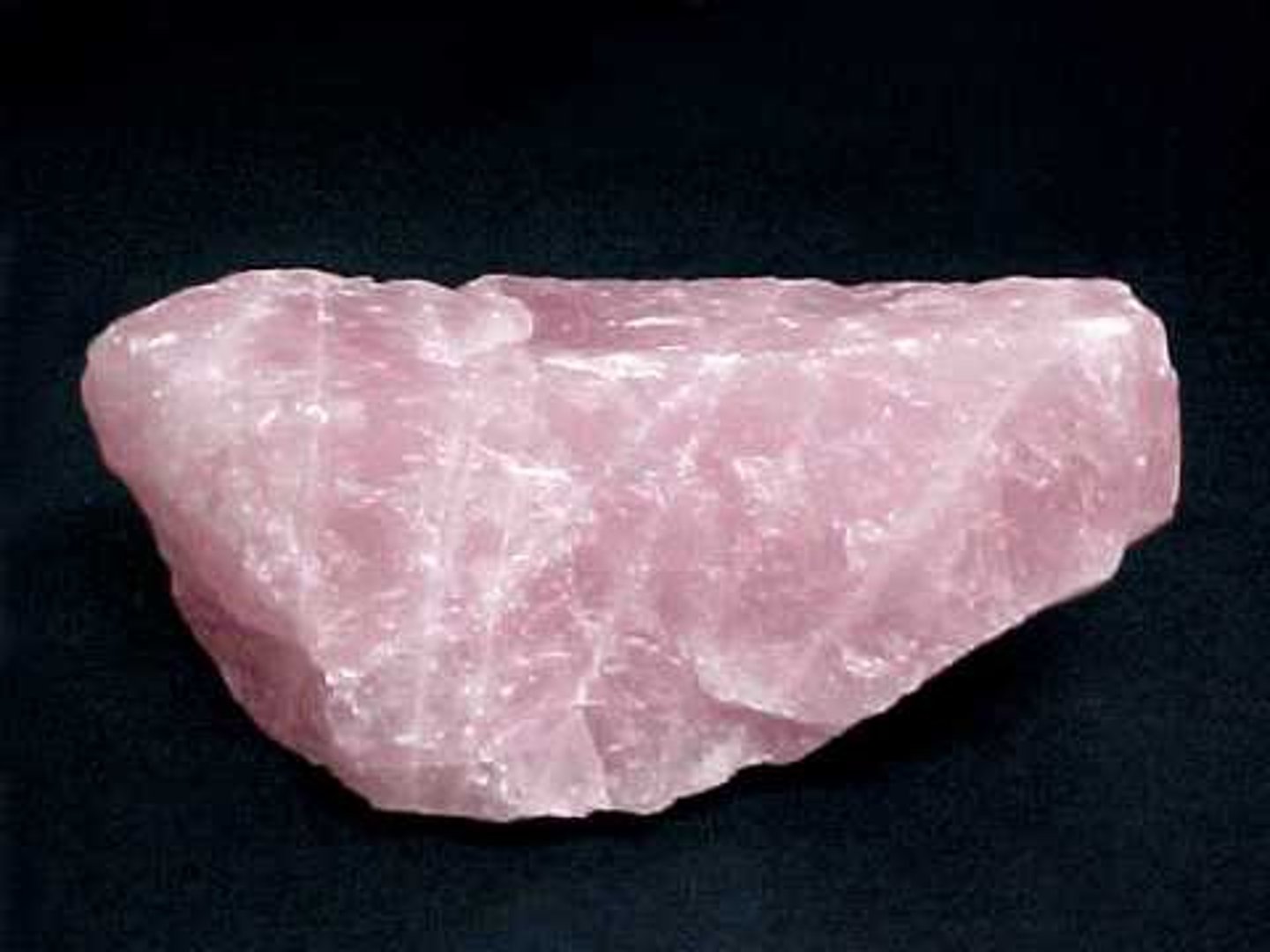 <p>Rock-forming mineral; hardness 7 (harder than glass), clear or variety of colors from pink to black depending on impurities, six-sided crystals, conchoidal fracture</p>
