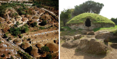 An artificial mound of earth or stone, especially over an ancient grave.