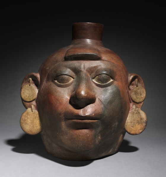 \-Moche art very realistic, especially their clay works, many of these heads, all individualized; smooth features of face and jewelry is also individualized

\-stirrup spout indicative of Moche vessels

\-1st has vertical bands of paint, 2nd has double earrings and was a foreigner to Moche, portrayed differently with a bun on his head (prisoner of war or a foreign ruler)

\-found in burials but used beforehand, given as gifts among high ranking men, used for ceremonial purposes during life