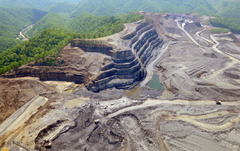 <p>Minerals close to the surface, remove soil and rock to expose them, then return unwanted waste material.</p>