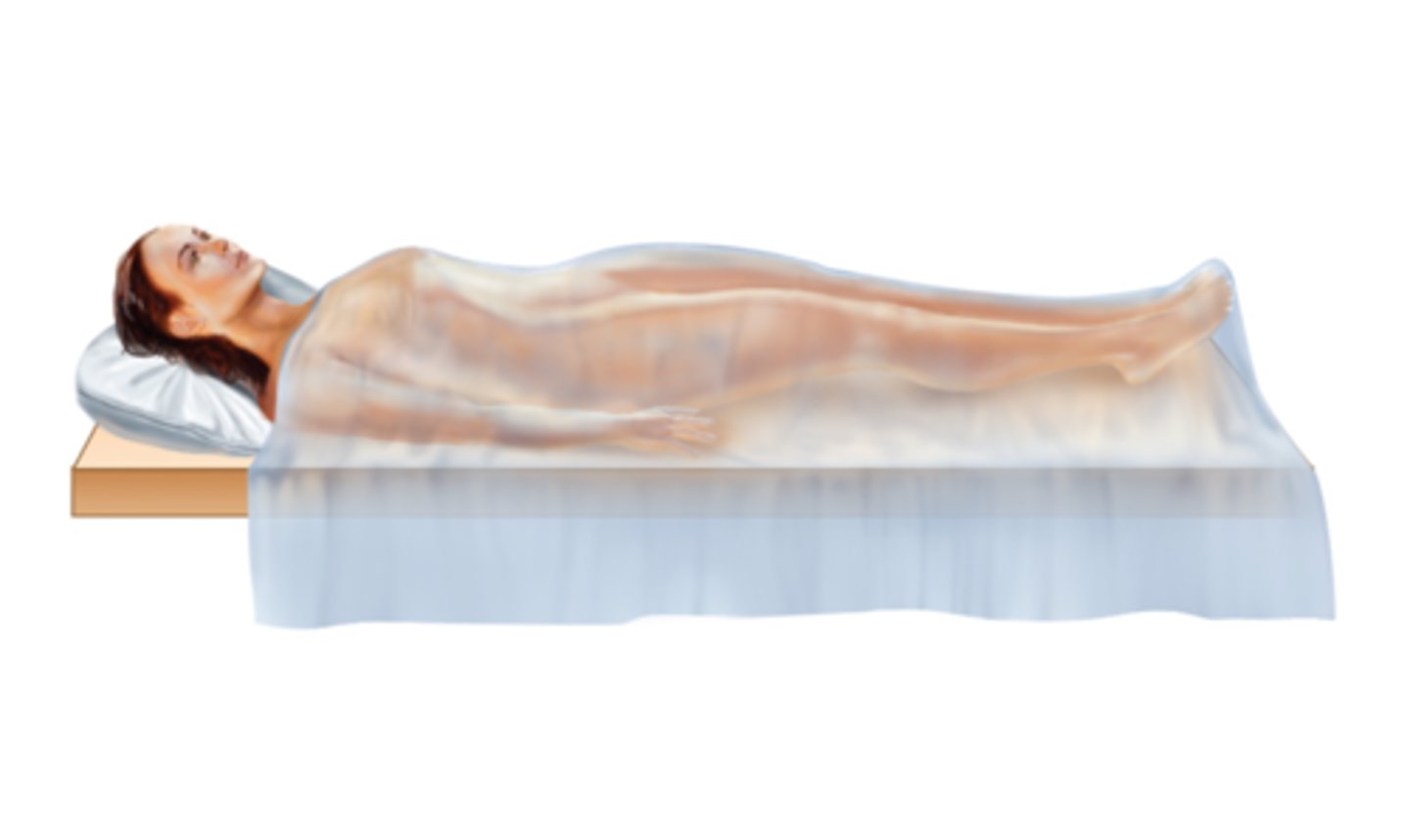 <p>Lying flat on back with face upward and arms at the side</p>