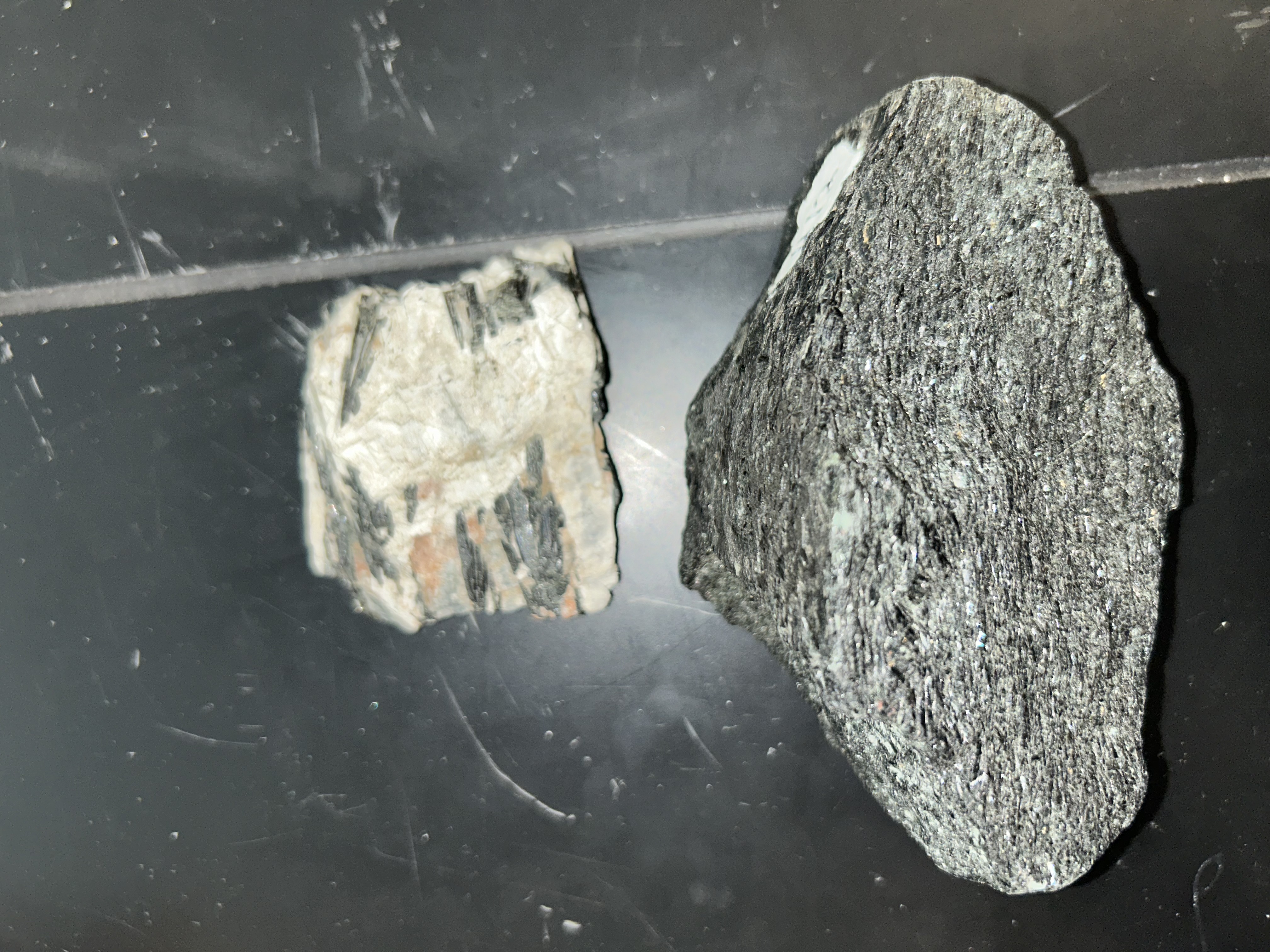 <p>black</p><p>thin needle crystals</p><p>cleavage at 120 and 60</p>