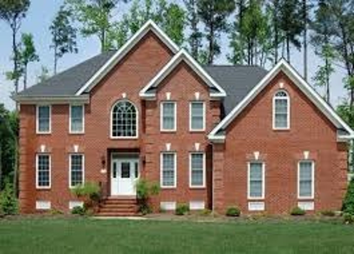 <p>The house is (made of) brick</p>