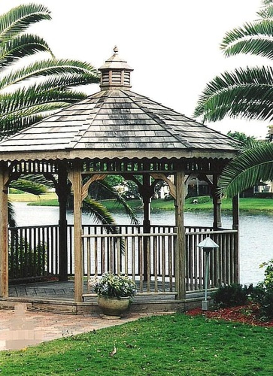 <p>a freestanding roofed structure, usually open on the sides, affording shade and rest in a garden or park</p>