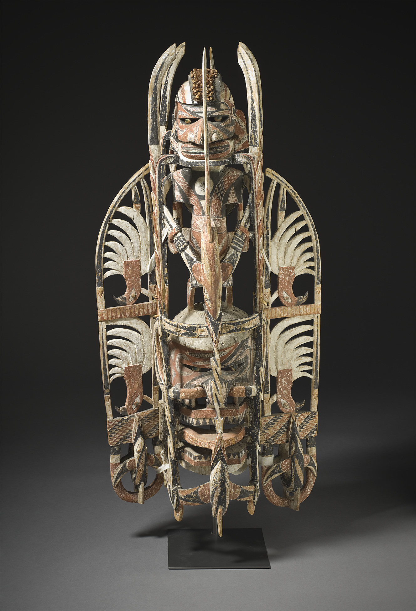 <p>In the malagan mask shown, the artist organized the composition to convey a sense of formal balance by</p><p></p><p><strong>A&nbsp;</strong>adding a variety of textural accents to the smooth wooden form</p><p><strong>B&nbsp;</strong>positioning motifs asymmetrically to enhance the uniqueness of the surface patterns</p><p><strong>C </strong>carving similar elements on either side of a centrally placed vertical axis</p><p><strong>D </strong>building in additional features to customize the standard mass-produced base</p>