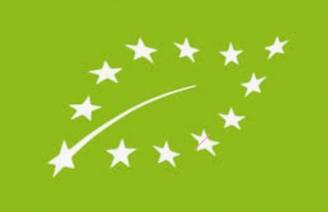 <p>Green symbol with stars in a shape of a leaf</p>