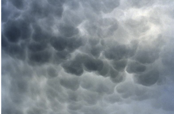 <p>This cloud type, pictured, is associated with what other cloud type?</p>