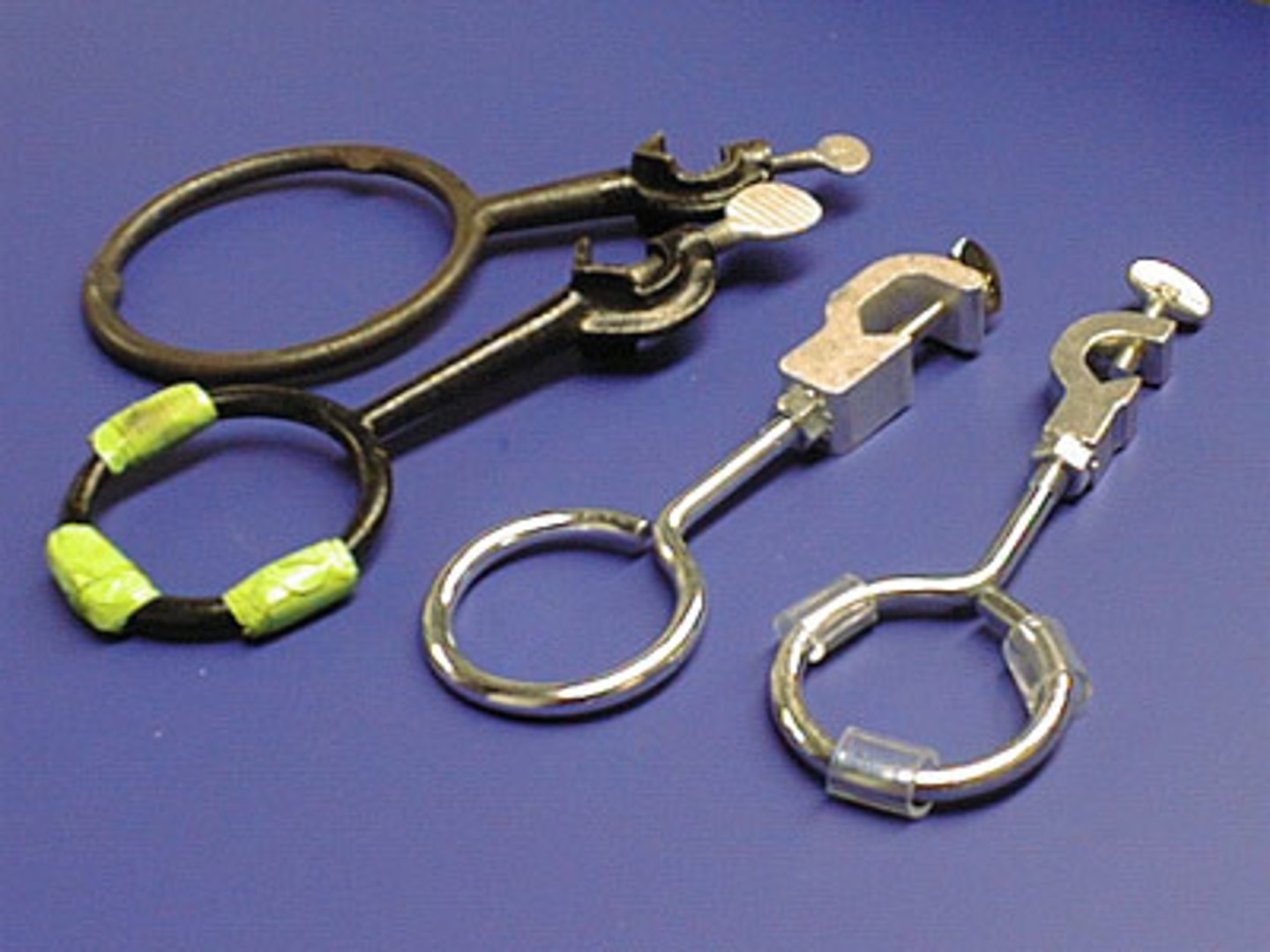 <p>used with ring stand to hold a glass container</p>