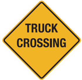 Watch for trucks entering or crossing the roadway. 