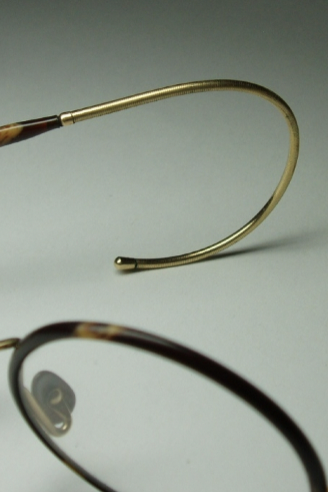 <p>used for children and sports</p><p>curl extends behind ear- consists of coiled spring</p>