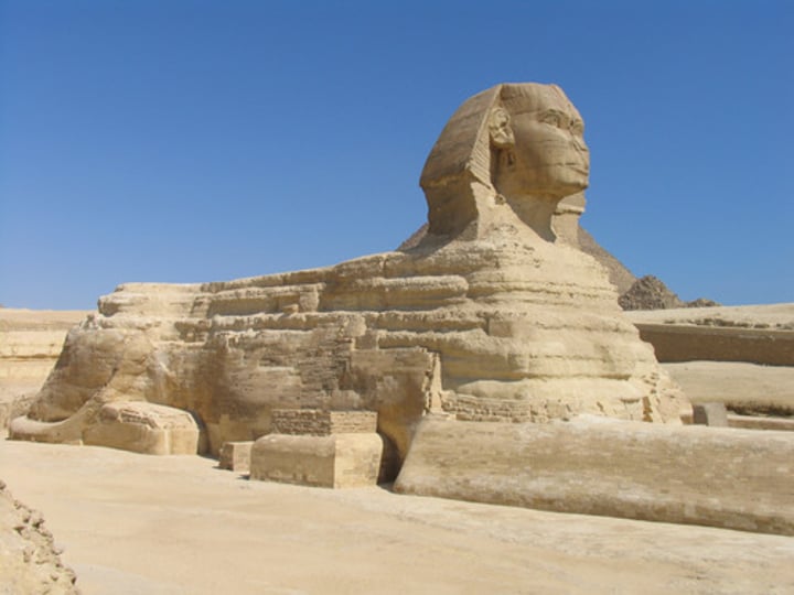 <p>Sculpture usually in recumbent position with the head of a man and the body of a lion; guardian of the temple</p>