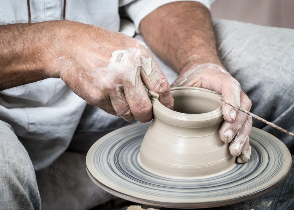 <ul><li><p>The basic shape was made on a potter’s wheel </p></li></ul><p></p><ul><li><p>patterns were applied later </p></li></ul><p></p><ul><li><p>An <strong>iron-rich slip</strong> ( made from water and clay ) was added and <strong>depending on the temperature of the kiln</strong>, it would turn <strong>red or black</strong>. </p></li></ul><p></p>