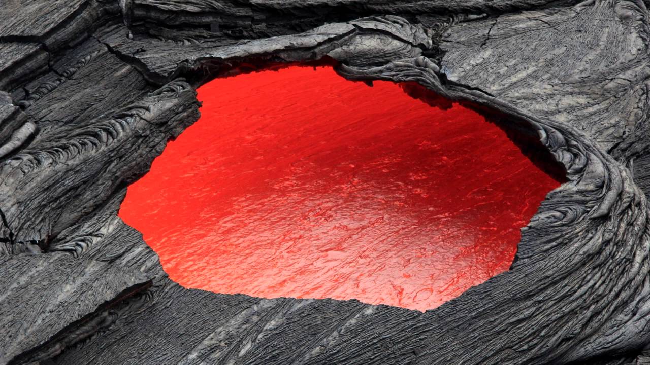 <p>an opening in the roof of a lava tube</p>