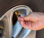 <p>remove cap from <strong><em></strong></em> and use a <strong><em></strong></em>___ to check tire pressure</p>