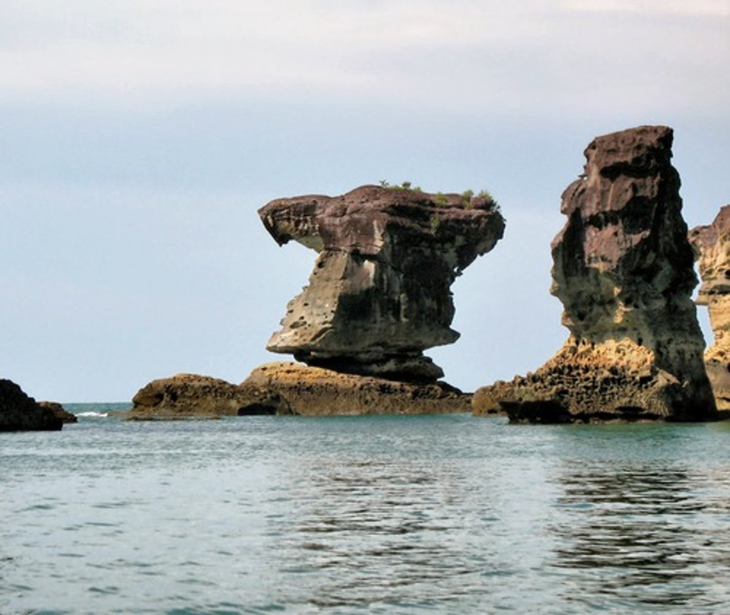 <p>. Columns of rock left after the top of the sea arch collapses</p>