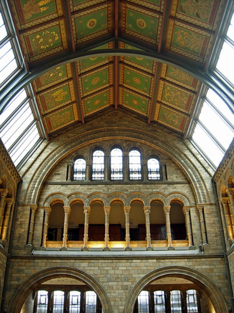 <p>a portion of interior rising above adjacent rooftops and having windows to admit daylight</p>