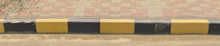 <p>Yellow and black curb</p>