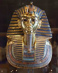 <p>gold funerary mask made with 22 pounds of cold and has inlays of lapis lazuli and carnelian.</p><p>From the tomb of tutankhamun, in the Valley of the Kings at Thebes.</p><p>A ceremonial mask placed over the face of the mummified Pharaoh.</p><p>Designed to protect the pharaoh and help his soul transition to the afterlife. </p>