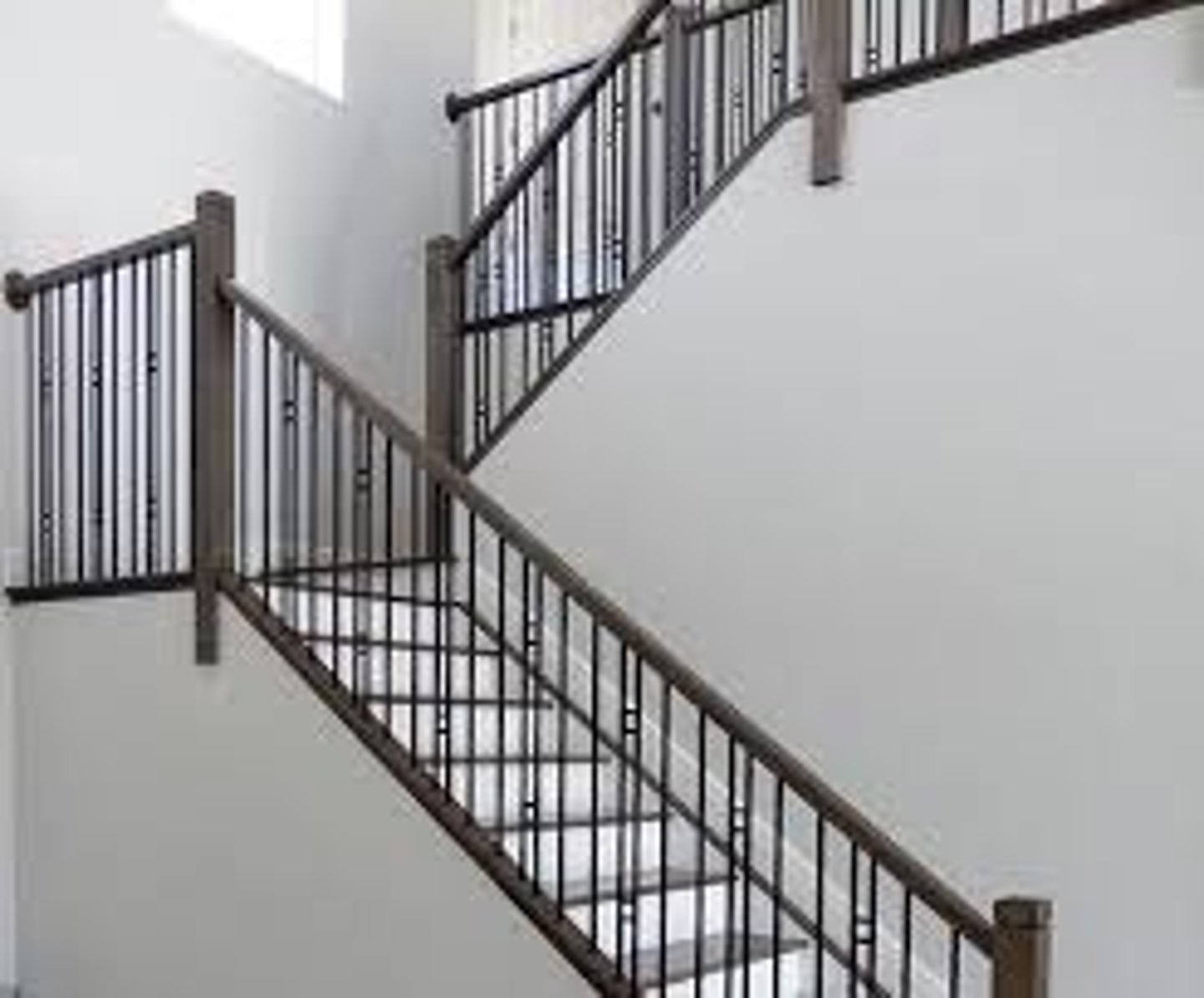 <p>a barrier composed of one or more horizontal rails supported by spaced uprights or balusters</p>
