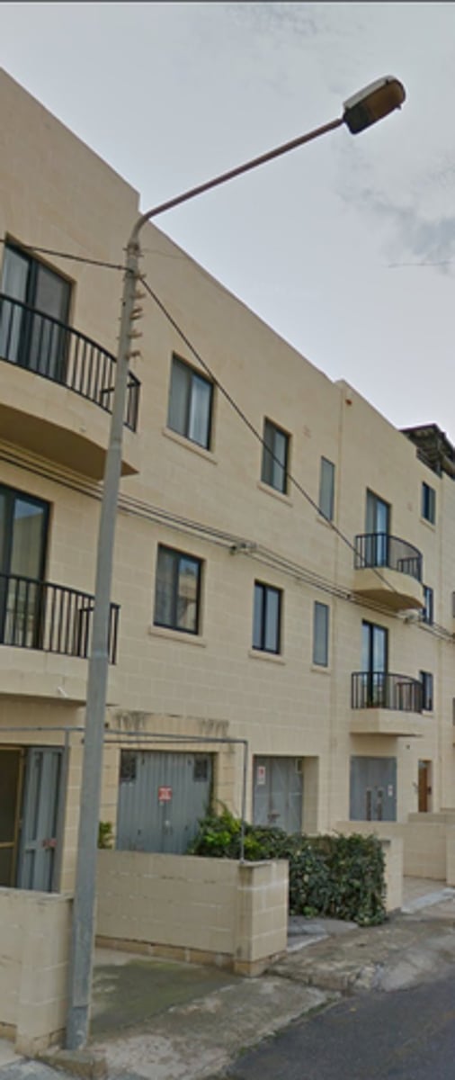 <p>Electricity poles that double as street lights painted a tan colour</p>