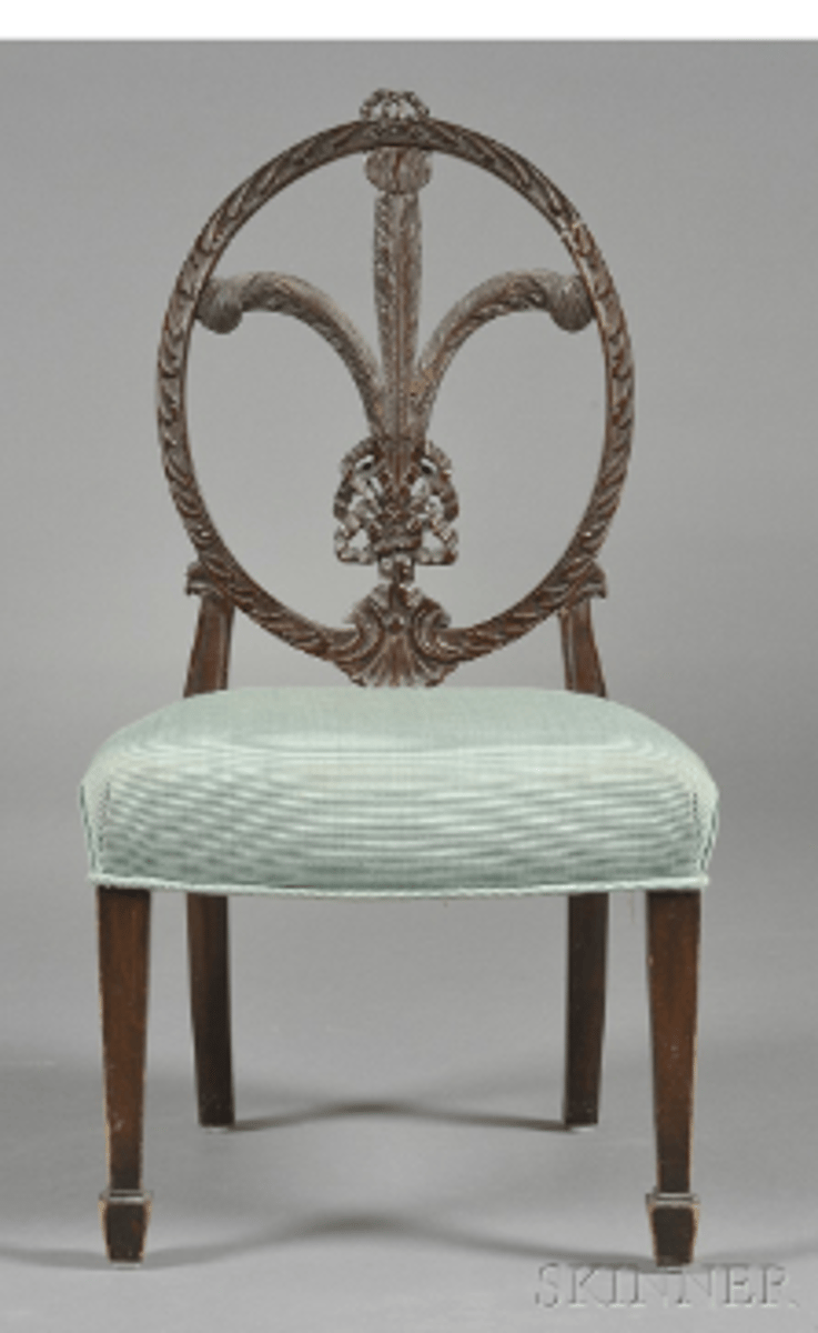 <p>Adam-style chair with backrest consisting of decorative carved or painted feathers.</p>
