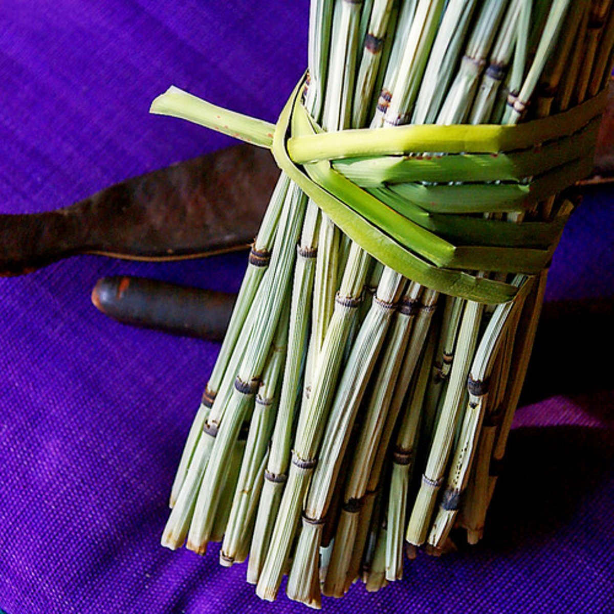 <p>A number of objects tied or wrapped together; a package</p>