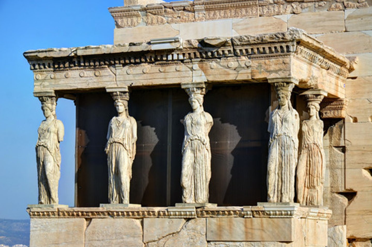 <p>a stone carving of a draped female figure, used as a pillar to support the entablature of a Greek or Greek-style building.</p>