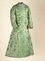 <p>a loose-fitting garment, often a dressing gown or jacket, with origins in India and later adopted in Europe</p><ul><li><p>symbolized wealth, sophistication,</p><p>cosmopolitanism</p><p></p></li></ul><p></p>