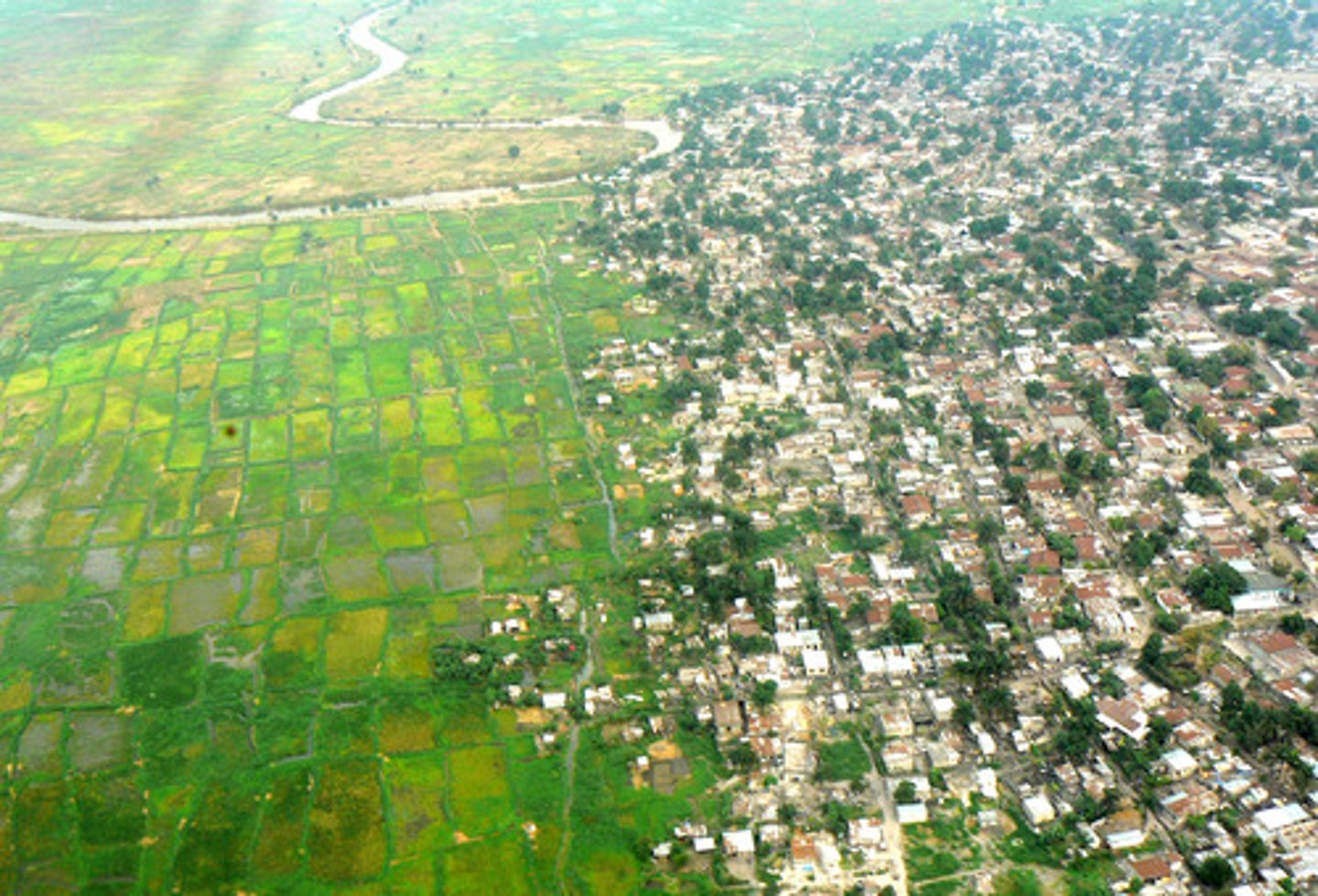 <p>(n) The parts far from the center, as of a town.</p>