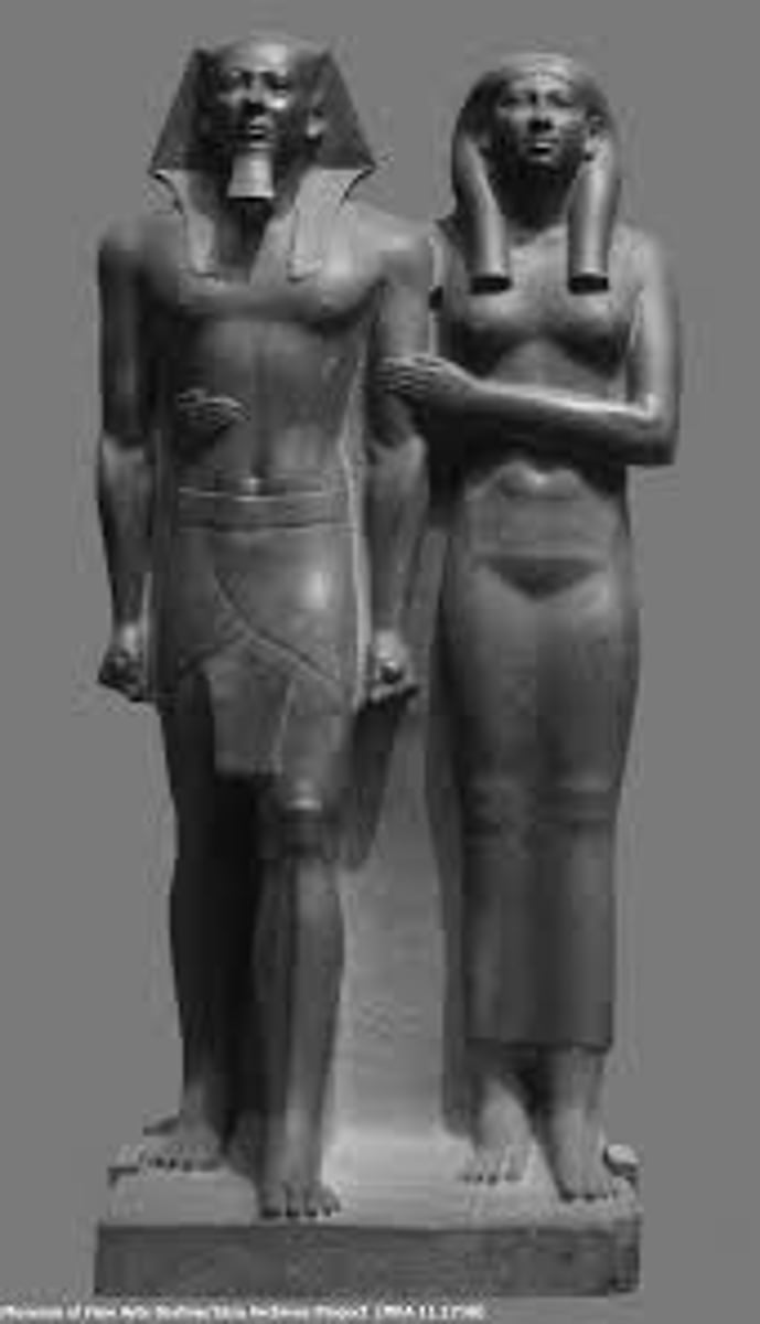 <p>Old Kingdom, 2490-2472 BCE, greywacke. Idealized, rigid figures symbolizing eternal rule.</p>