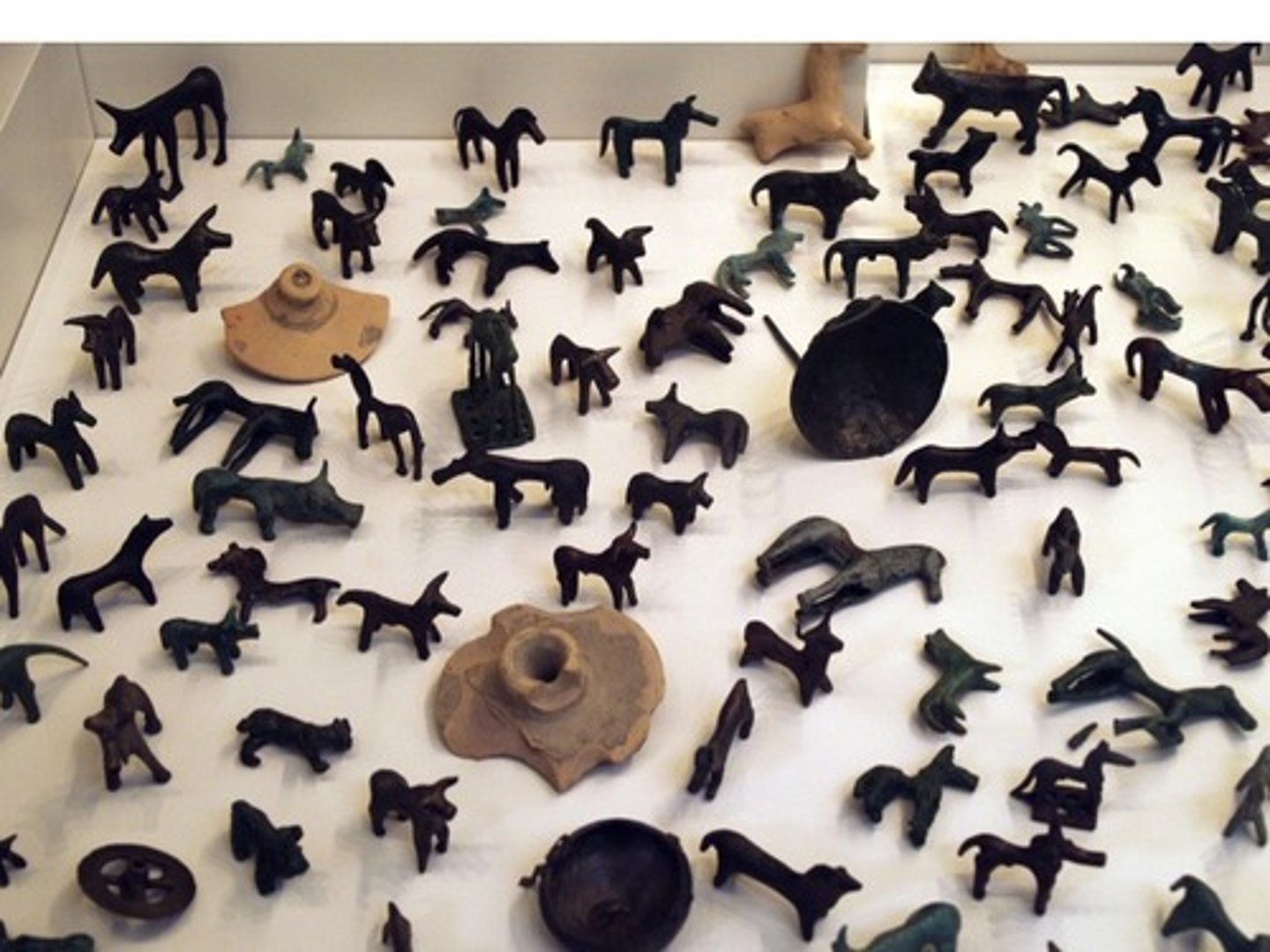 <p>Who: The animal figurines were created by ancient Greek artisans, possibly by local workshops in Argos, Korinth, Lakonia and on Crete, or by itinerant bronzesmiths coming from different regions of the Peloponnese and working temporarily in the neighborhood of the sanctuary1.</p><p>What: These are bronze animal statuettes2. They were votive gifts, dedicated to the gods as a form of worship3.</p><p>Where: The figurines were discovered in Olympia, Greece3. They are currently on display in the Archaeological Museum of Olympia32.</p><p>When: The figurines date back to the 8th - 7th century BC2.</p><p>Why it's interesting and important: These figurines provide valuable insights into the religious practices and beliefs of ancient Greece. They often depict warriors, charioteers and, of course, athletes such as the mid-6th century BC statuette of a discus thrower or the early-5th century statuette of a runner3. More than 14,000 bronze artifacts were preserved buried in the soil of Olympia, by far the largest number ever found in a region of the ancient Hellenic world3.</p>