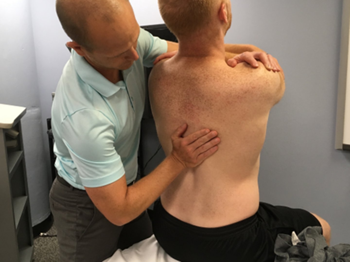 <p>SNAGS - lumbar/thoracic techniques: </p><p>Ulnar border of your hand is placed under the SP or TVP of target segment</p><p>Stand to the side of the patient (so as to not block extension)</p><p>Glide vertebra upward as patient extends</p><p>Use belt to fix the pelvis if necessary</p><p>NOTE: patients must NOT lean back into your hand = rather they should extend over your hand</p>