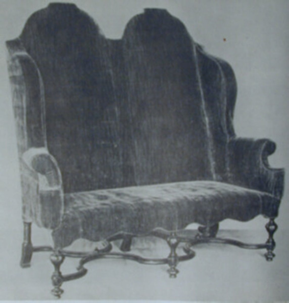 <p>couch</p><p>two chair backs put together to form winged back settee</p><p>6 turned legs</p><p>flat stretcher</p><p>carved facade</p><p>rich elaborate textiles</p>