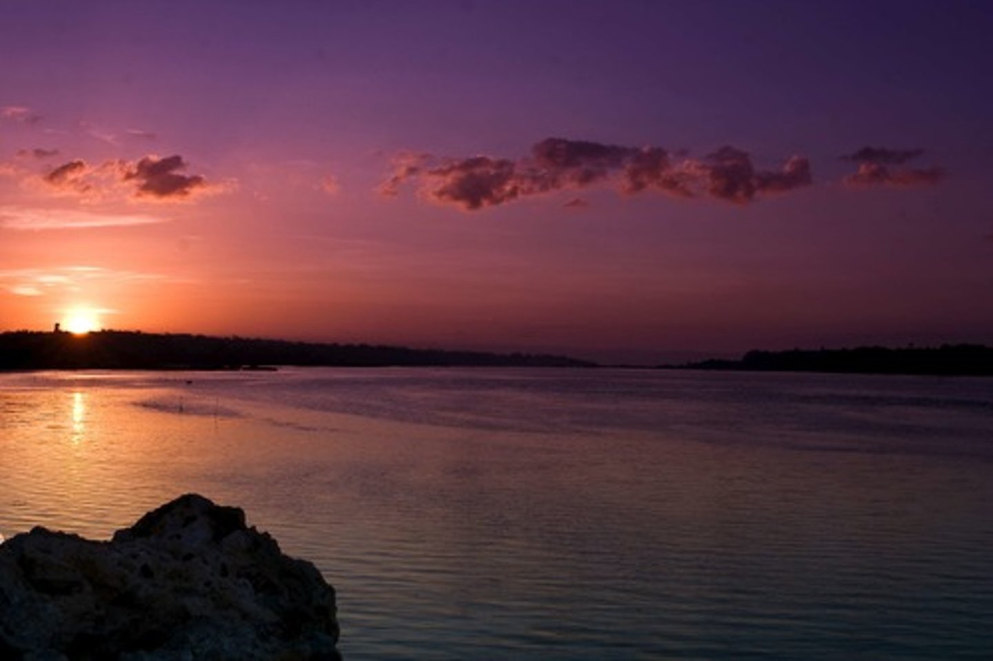 <p>(prep) vượt ra ngoài, ở ngoài</p><p>example: The mountains are ___ the valley</p>