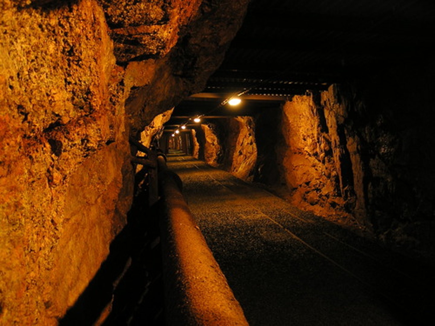 <p>vertical tunnels are built to access and then excavate minerals that are underground and otherwise unreachable</p>
