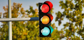 <p>Lights on the road that change colors (red, yellow, and green) and tell drivers when to stop or go.</p><p>"The <strong>traffic lights</strong> turned green, so we could go on driving."</p>