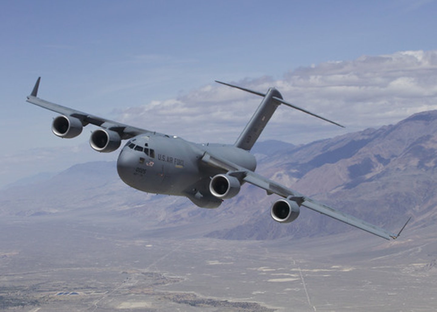<p>4 jet engines, has winglets, Cargo and personnel transport</p>