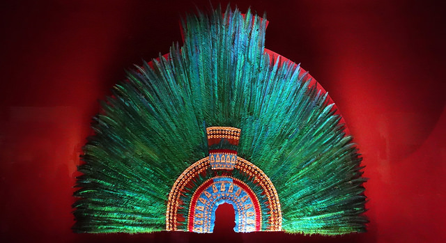 <p><strong>Context: </strong>could have been a gift from Moctezuma brought by Hernan Cortes to emperor Charles. People are unsure if it actually belonged to Moctezuma but it was found in a European inventory in 1596 acquired by Austrian Archduke Ferdinand II van Tyrol. </p><p>-Costume was very important to the Aztecs. However, the headdress is a static item. When worn, it completely transforms your appearance, but makes your identity less important than what you wear. </p><p>-Amanteca, feather workers, are very regarded (they make this)</p><p></p><p><strong>Form: </strong>male quetzal feathers (each bird only has 2/3). This is found mainly all over in Central America, so tribute is being sent to Tenochtitlan as well. When the Aztecs conquer new peoples. they exact luxury goods like the feathers. Very iridescent</p><p>-pure gold ornaments, and other feather colors (turquoise) </p>