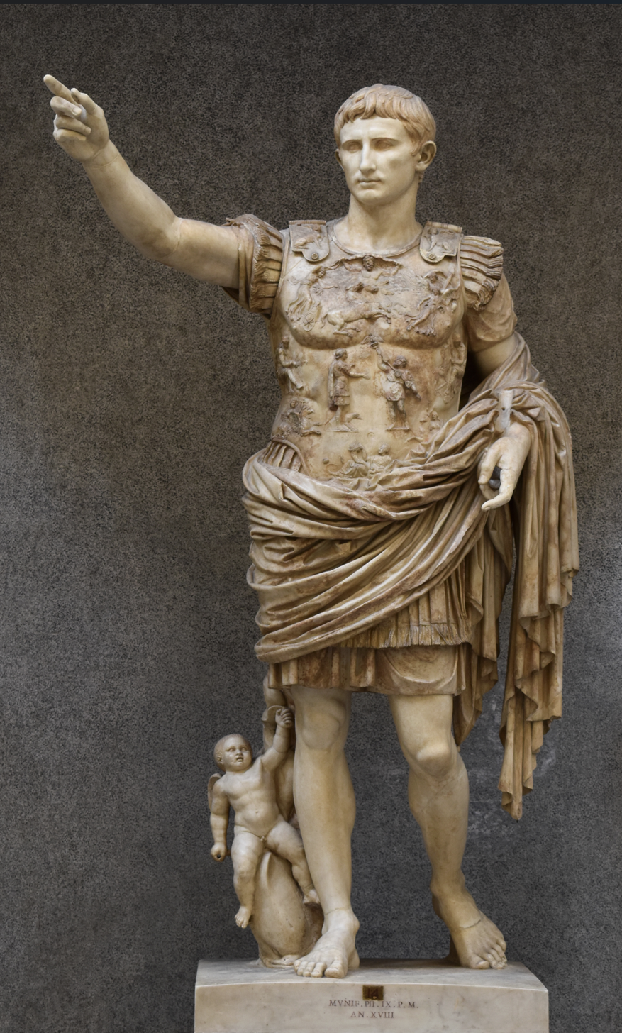 Portrays Augustus as a general with a cupid and a dolphin. The dolphin representing a victory of the Battle of Actium and was meant to show case his power as a ruler. The statue has a mixture of Polykleitos style of idealization and the verism that was common in Roman statues. 