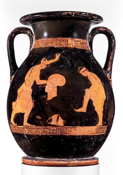 <p>- could be compared to the Pronomos Vase' depiction of actors preparing</p><p>- depicts two actors or chorus members getting into costume</p><p>- both are male dressing as women</p><p>- the actor on the left is fully dressed, wearing a mask - indicated by gapong mouth</p><p>- the actor on the right is putting on high boots, known as kothornoi, which had thin, soft soles and turned up toes for easy movement</p><p>- his life-like mask lies on the floor beside him</p>