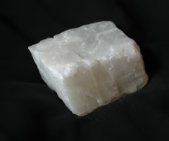 <p>colorless streak, perfect fracture in 3 directions, vitreous luster, white/colorless color. occurs in many rocks like limestone, marble, and cave formations. accumulates in soil Ck horizons in arid regions. known as lime in finely powdered form and used to correct soil acidity. effervesces (bubbles) freely with cold HCl dilution.</p>