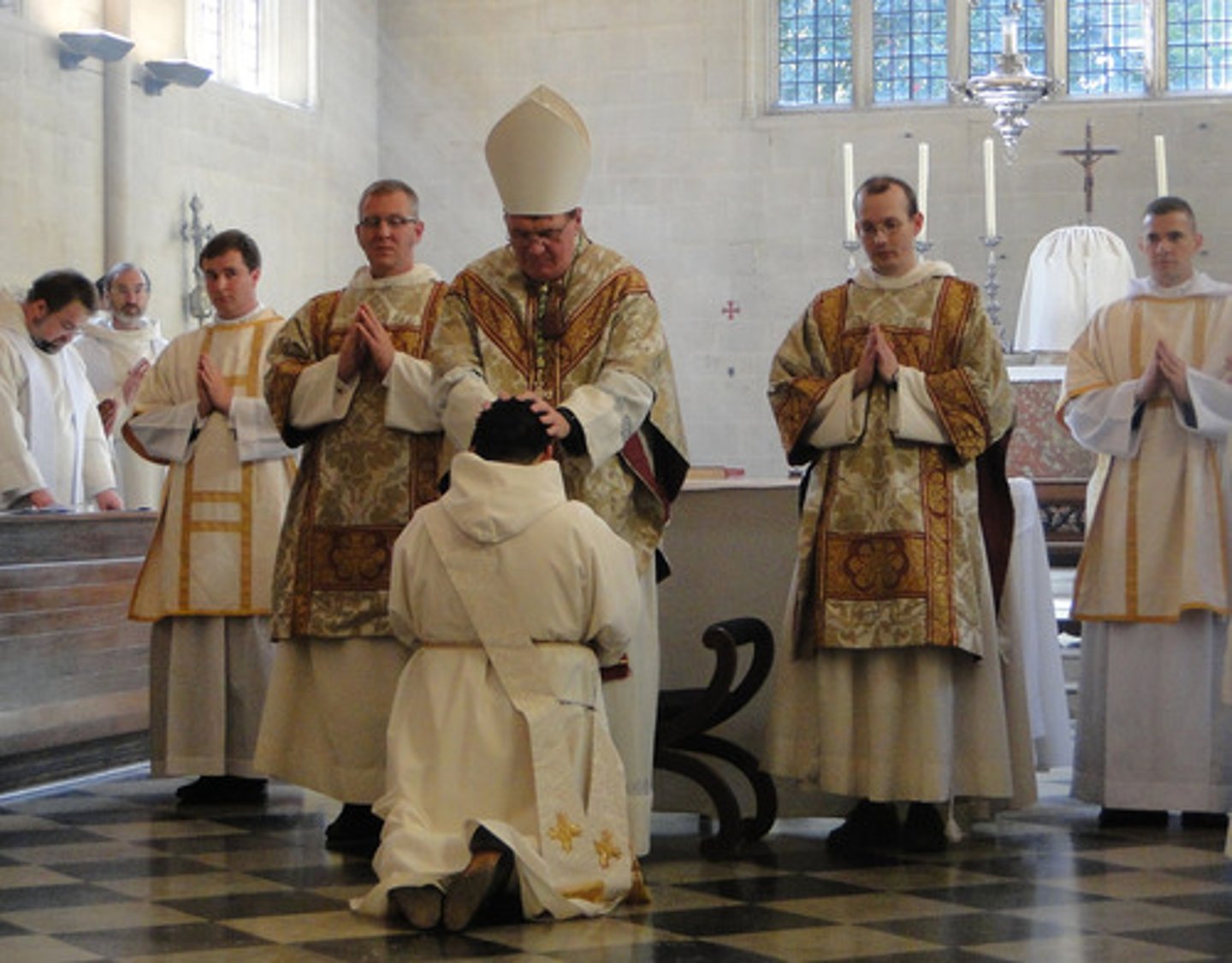 <p>v: to officially make sm a priest</p>