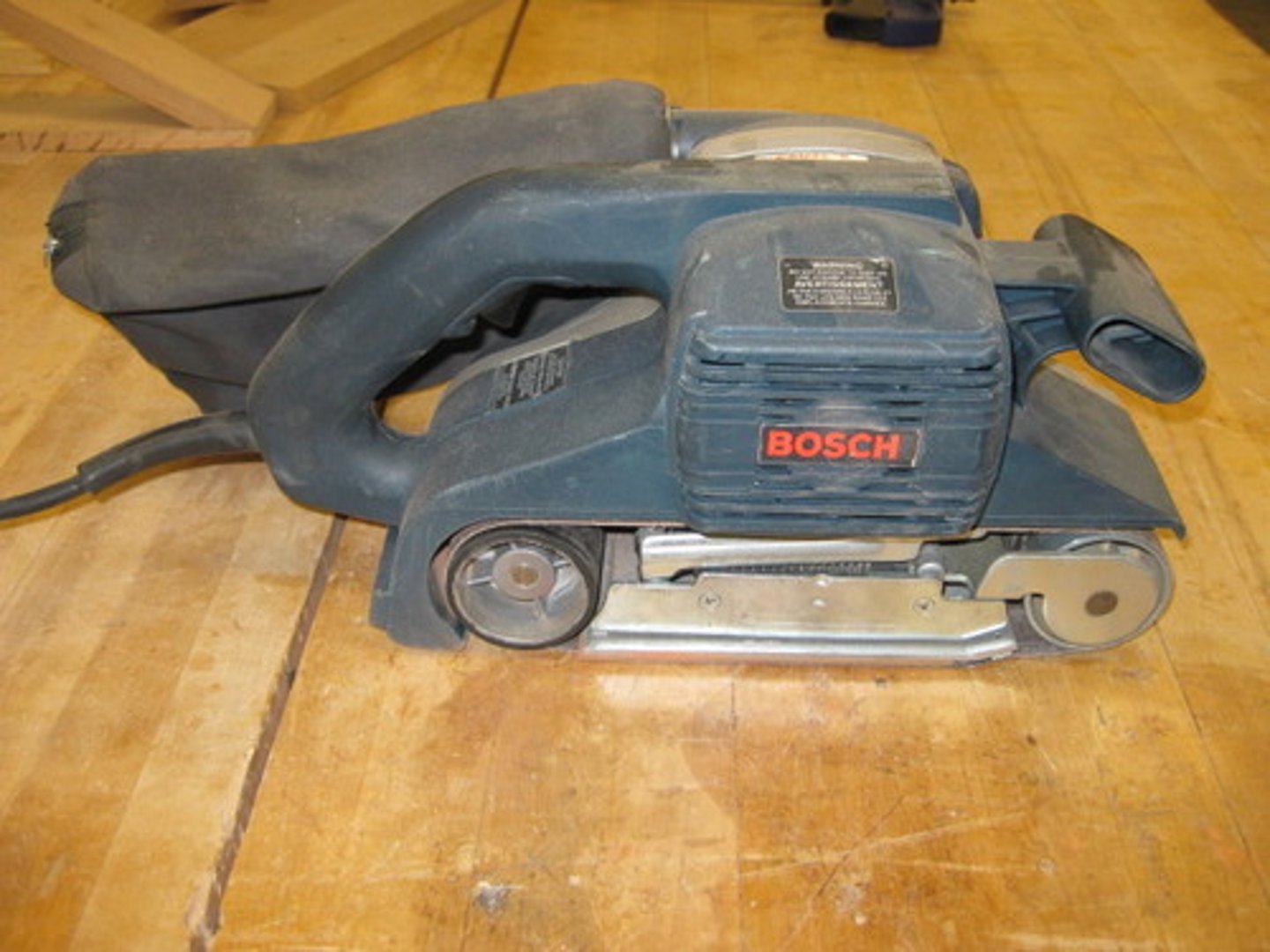 <p>Sand down wood in larger areas</p>