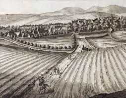 The 16th and 17th century process in which English landlords evicted small farmers and fenced in the "commons" (formerly communal farm and grazing land previously open to all). This process created a social crisis in England as thousands of landless people flooded into English cities looking for jobs that didn't exist, and they were denounced as rogues, vagabonds, and vagrants. This social crisis the larger context in which many landless English men became interested in migrating to America for better opportunities.