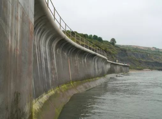 <p><mark data-color="green">Concrete structures</mark> that <mark data-color="green">absorb and reflect wave energy</mark>, with <mark data-color="green">curved surface</mark></p>